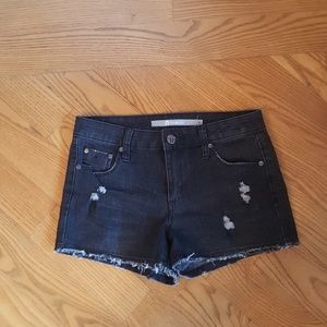 Distressed black jean shorts